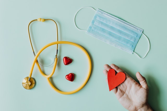 stethoscope, mask, and hearts to show how we care about travel nurses