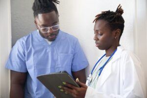 Nurse talking to doctor for dialysis travel nurse jobs